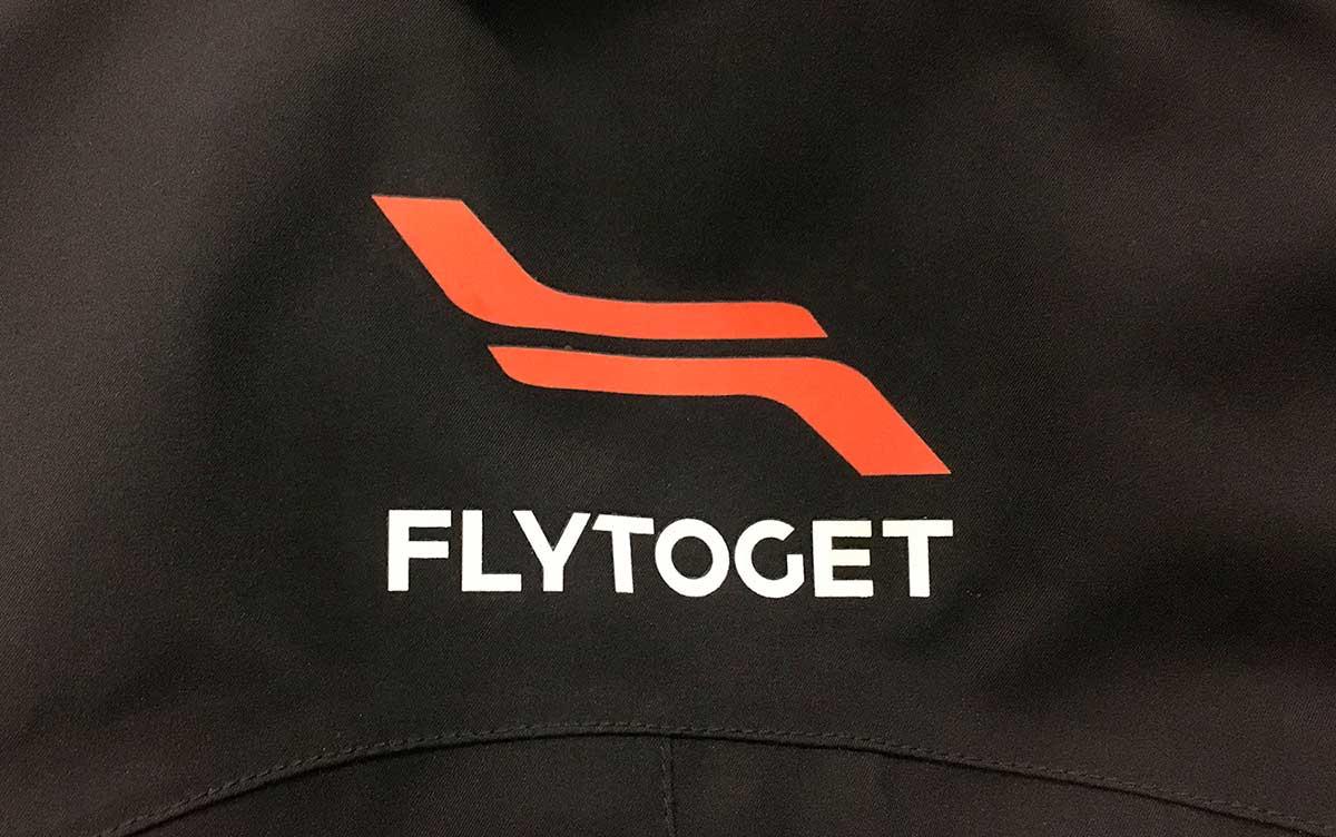 Printed Flytoget logo on outerwear