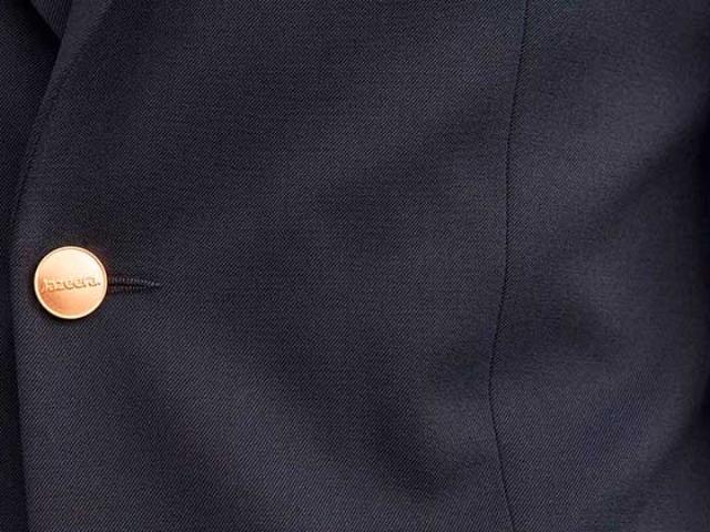Jazeera logo button on uniform jacket