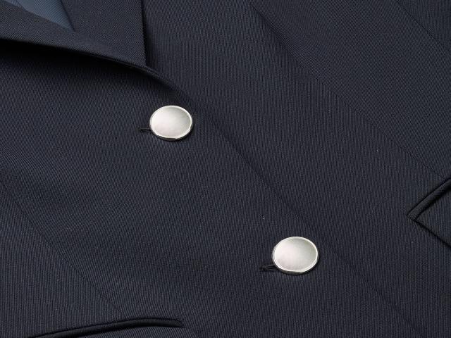 Two silver buttons on jacket
